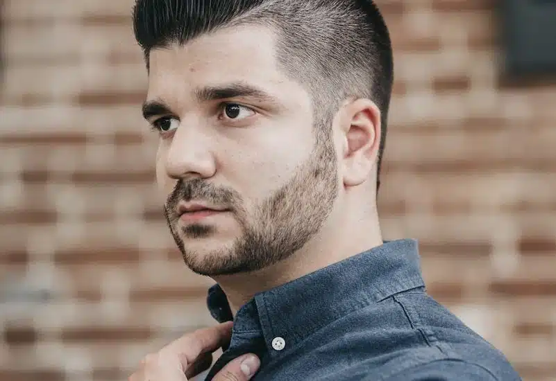 man wearing black button-up long-sleeved shirt