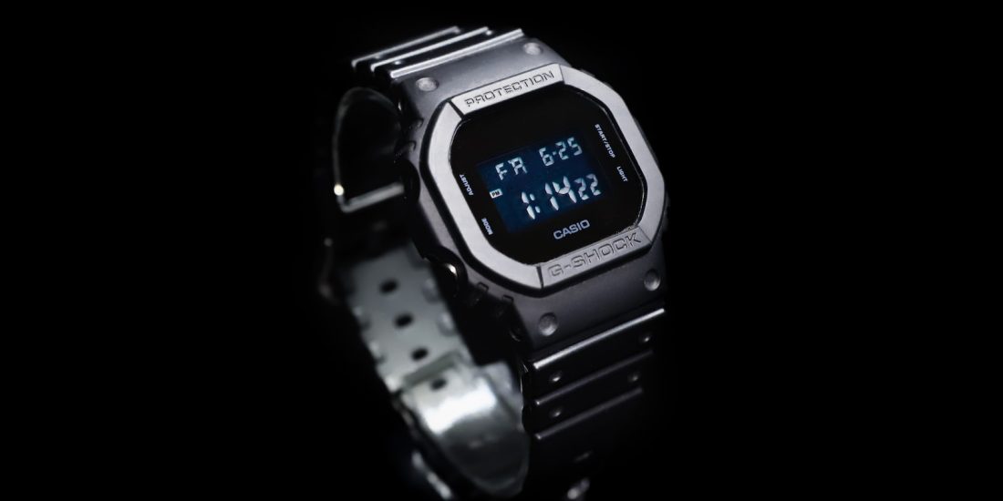 silver and black casio digital watch